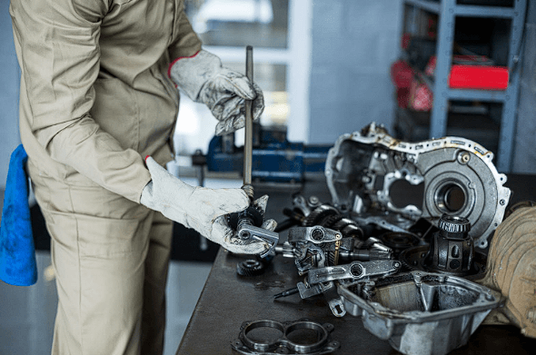 Mechanic checking car parts to ensure they’re in good condition