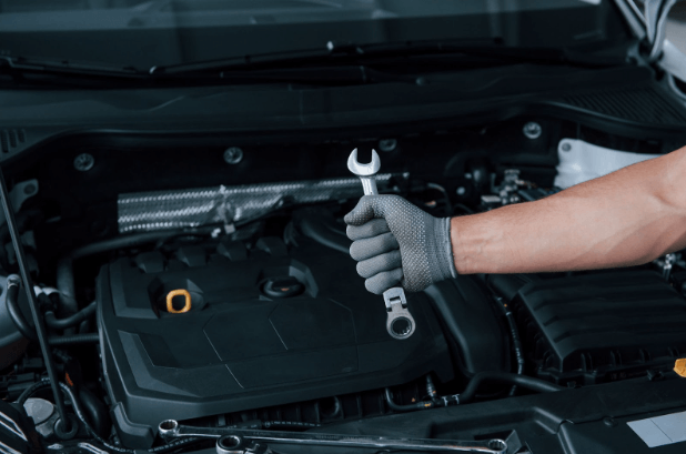 A mechanic inspecting whether the used car parts are of good quality