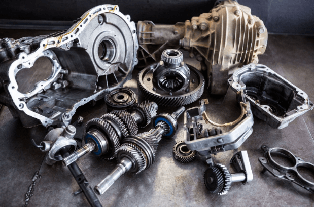 A collection of freshly purchased used car parts, ready to be placed inside an automobile.