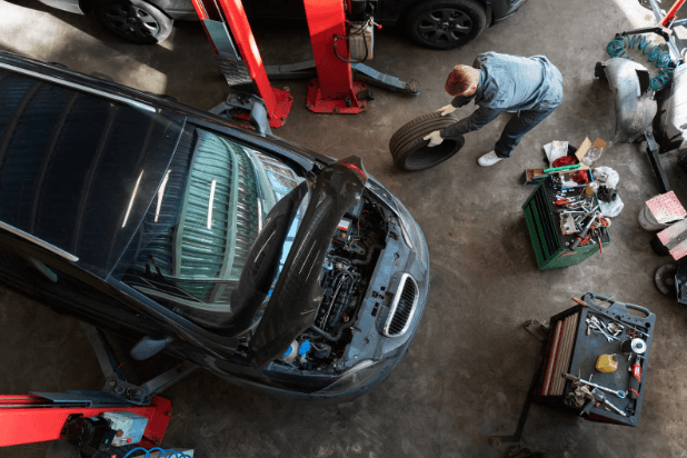 Used car parts replacement process performed by a skillful mechanic.