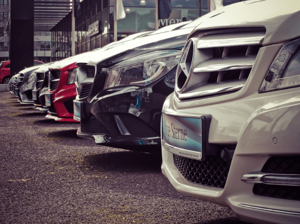 Automobiles lined up at a used car dealership